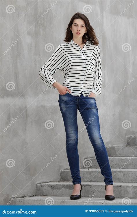 Full Length Portrait Of Young Fashionable Brunette Woman Practicing