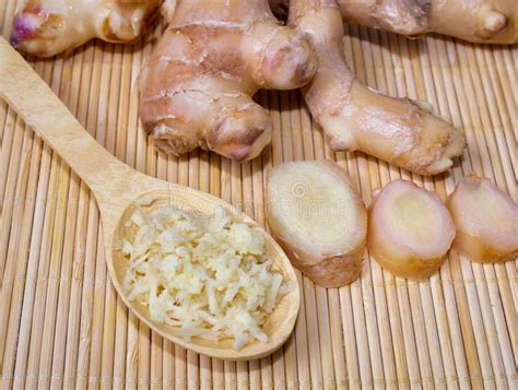 Fresh Ginger Root And Spoon With Grated Ginger A Healthy Product For
