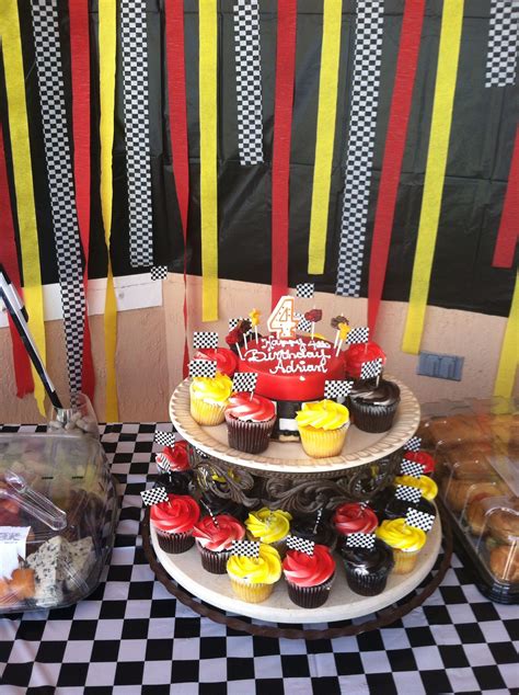 Red yellow black cupcakes race car cake | Race car birthday party, Race car birthday, Race car party