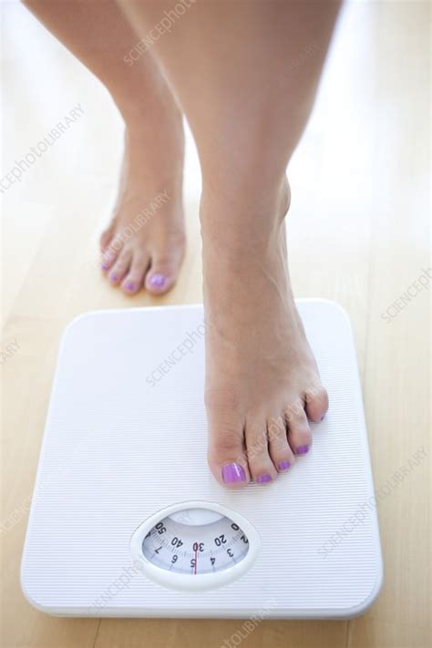 Woman Weighing Herself Stock Image F0034578 Science