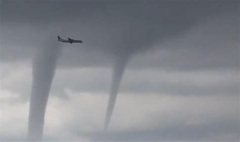 Watch Terrifying Moment Plane Flies Through Three Tornadoes During
