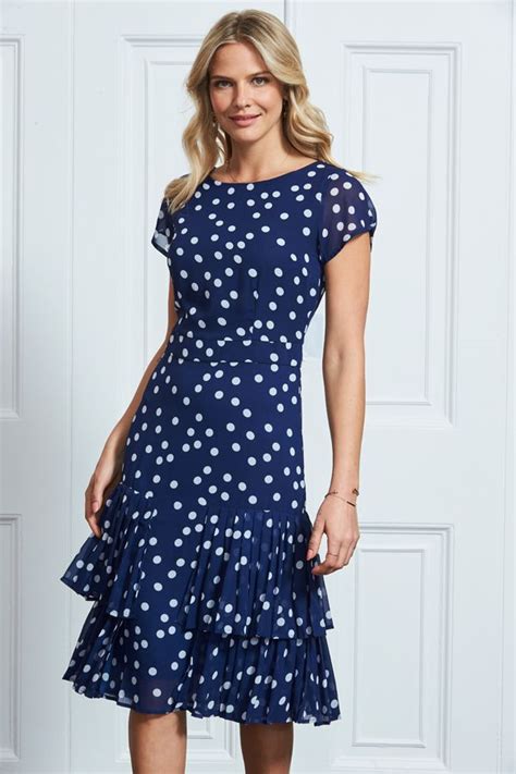 reasons to buy this dress was made for actiontimeless navy and white polka dot printsignature fit