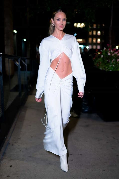 Candice Swanepoel Looks Incredible In A White Midriff Baring Dress As