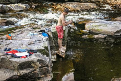 The Guy Is Swimming In Mountain River In Norway Stock Photo Image Of