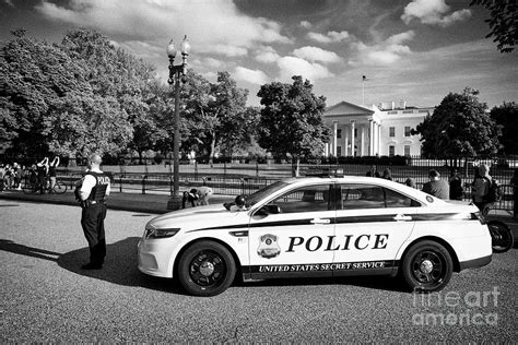 United States Secret Service Police Officer And Vehicle Outside The