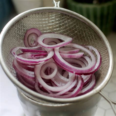 Pour out water through a mesh strainer, keeping onions in the jar. How To Make Quick-Pickled Red Onions | Kitchn
