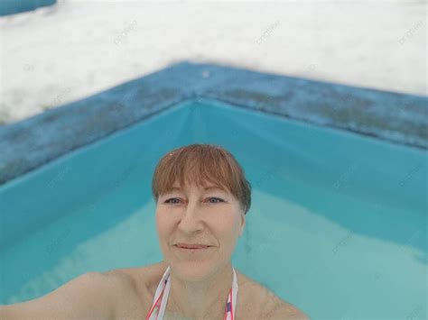Mature Woman Takes Wellness Selfie In Winter Pool Photo Background And Picture For Free Download
