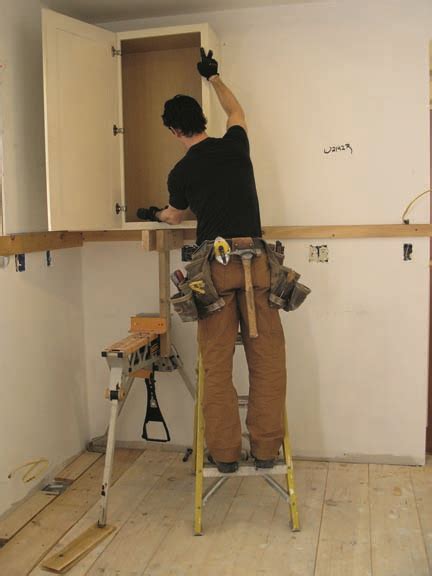 Upper cabinet, and you install the uppers first, and then the bases,you would have to tear down the uppers to get the countertops in, and reinstall the. How To Install Kitchen Cabinets - Old-House Online - Old ...