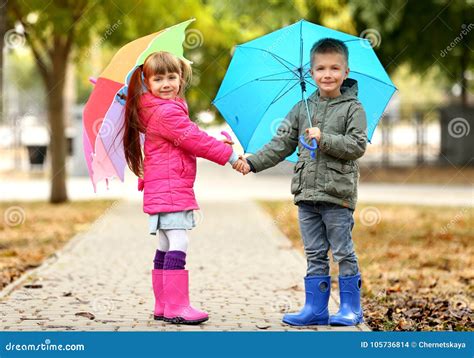 Cute Children With Umbrellas Stock Photo Image Of Growth Beautiful