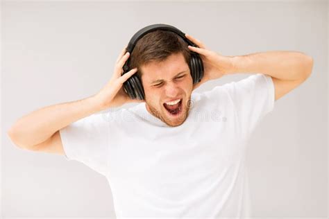 Man With Headphones Listening Loud Music Royalty Free Stock Photography