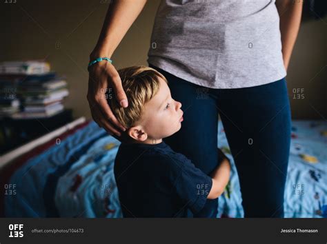 Boy Hugging His Mothers Leg Stock Photo Offset