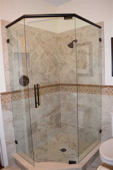 Doing so will allow the water to slope toward the drain. Corner Shower with Porcelain Field Tile and Travertine Trim | Traditional bathroom, Corner shower