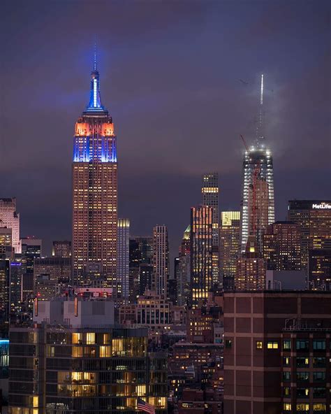 The Empire Building Lit Up In Blue And Orange