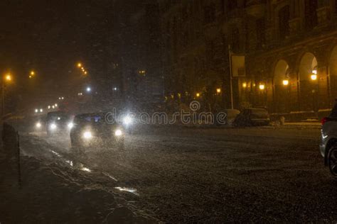 Winter Snow Storm Traffic Jam At Night Car Blurred At The Street