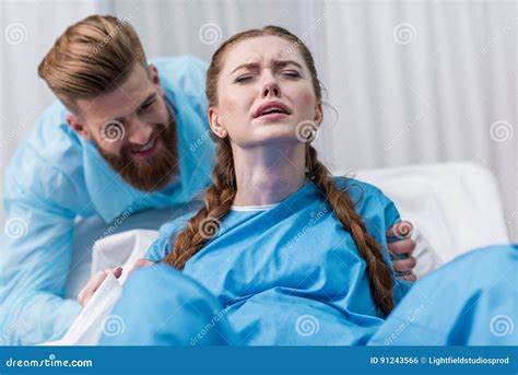 Pregnant Woman Giving Birth In Hospital Stock Photo Cartoondealer Com
