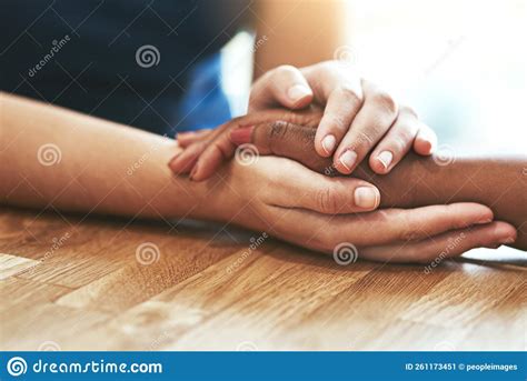 Youll Never Be Alone Two People Holding Hands In Comfort Stock Image
