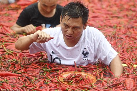 Chinese Chilli Eating Contest Gets Competitors Sweating As They Scoff