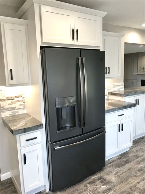 White kitchen cabinets with black slate appliances. GE Fridge in Black Slate | White cabinets black appliances ...