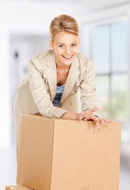 premium photo picture of attractive businesswoman with big boxes