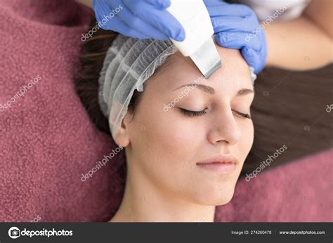 Beautiful Woman Receiving Ultrasound Cavitation Facial Peeling I Stock