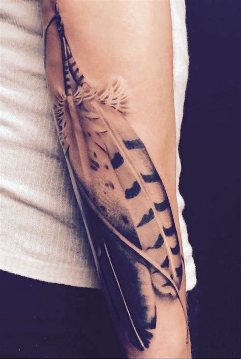 28 Astonishing Outer Forearm Feather Tattoo Ideas