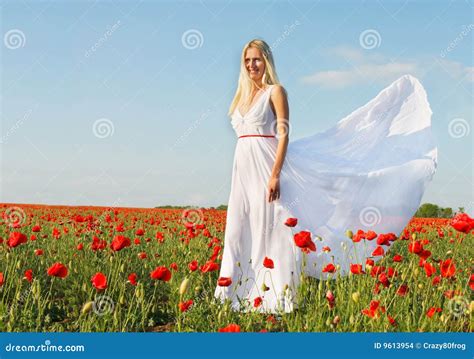 beautiful woman in white dress on poppy field stock images image 9613954