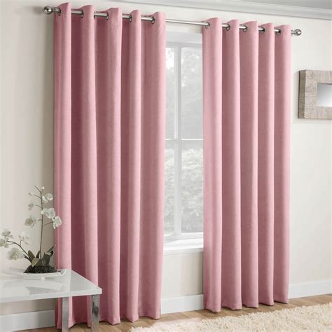 Everything from the old style pretty bed curtains, to the rocking horse, to the floor mat are done up in delicate pinks in this luxury bedroom for a little princess dressed in pink. Blush Eyelet Curtains Pink Thermal Block-Out Ready Made ...