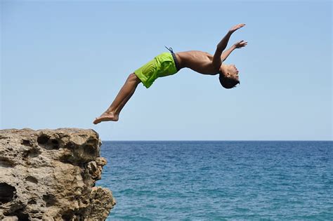 Royalty Free Photo Time Lapse Photography Of Man Jumping Off The Cliff