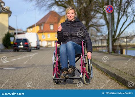 Using Wheelchair Ramp And Stairs Royalty Free Stock Image