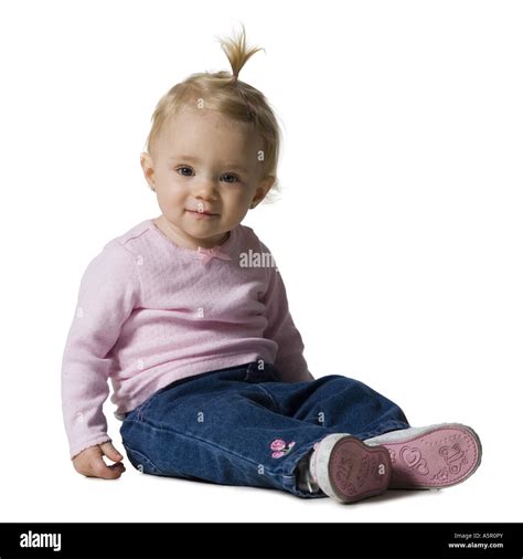 Baby Girl With Ponytail Sitting Stock Photo Alamy