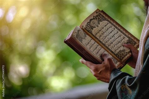 Man Holding And Reading Quran Islamic Background Arabic On The Text