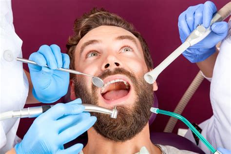 Close Up Men Patient With Open Mouth In Dental Clinic Stock Image