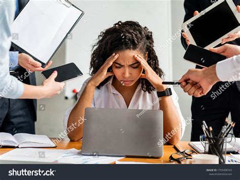 Multitasking Overworked Business Lady Sitting Stressed Stock Photo