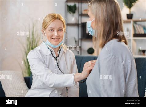 Professional Female Doctor Or Nurse Doing The Auscultation Of Her