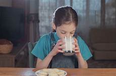 drinking girl milk storyblocks cookies young