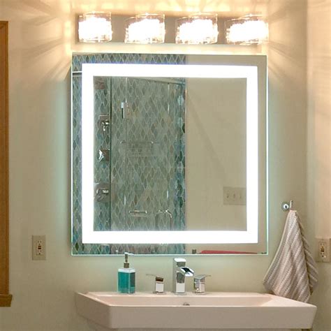 A sleek, contemporary design, this rounded rectangular mirror is ideal over a bathroom vanity but can also serve as an accent piece in an entryway, bedroom, or living room. Front-Lighted LED Bathroom Vanity Mirror: 48" x 48 ...