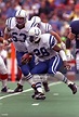 Running back Marshall Faulk of the Indianapolis Colts looks up field ...