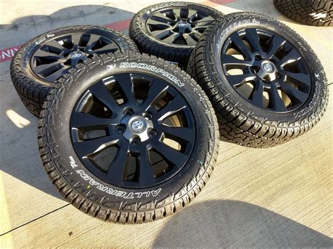 For my 12.5 inch tire, he said my stock 8 rims with. 20" Toyota Sequoia Platinum OEM Matte Black wheels