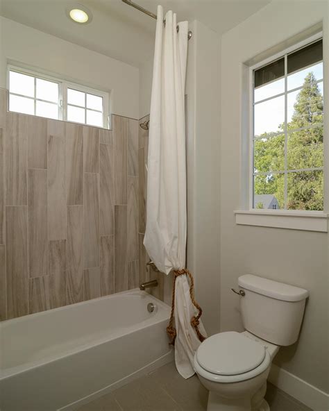 Coastal Guest Bathroom With Wood Look Tile Shower Hgtv