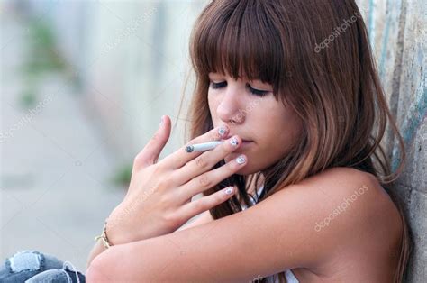 Teenage Girl Smoking Cigarette — Stock Photo © Solidphotos 60723527