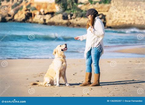 Pregnant Woman Enjoys Her Dog By The Seaside Stock Image Image Of