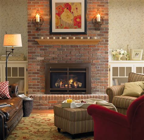 The artwork reflects the blue and black colors used throughout the room. Red Brick Fireplaces - Hearth and Home Distributors of Utah, LLC