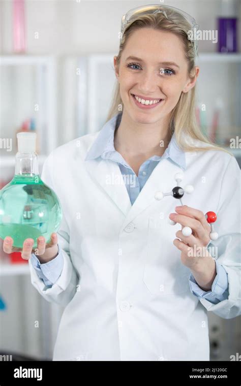Female Scientist Examining A Three Dimensional Model Of Dna Stock Photo