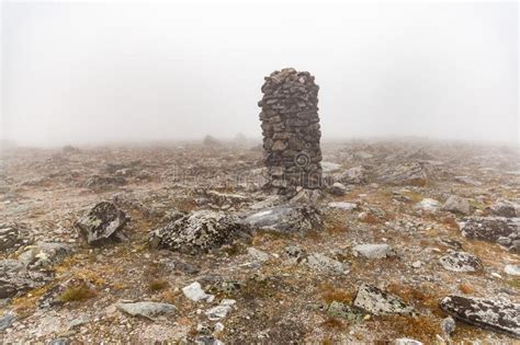 Small Built Stone Towers Among Stones With Moss In The Foggy Landscape