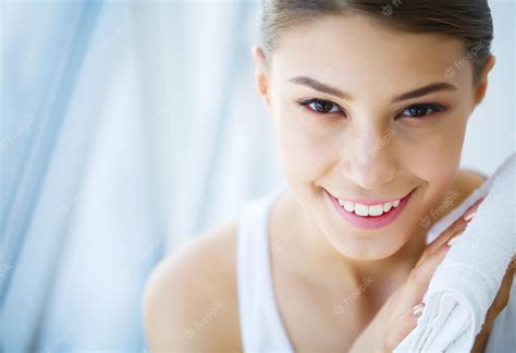 Premium Photo Face Washing Happy Woman Drying Skin With Towel