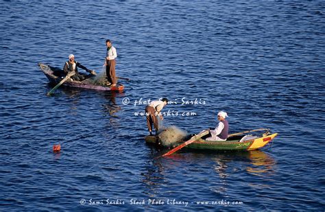Fishermen With Nets In Boats On The Nile River Esna Egypt Sami