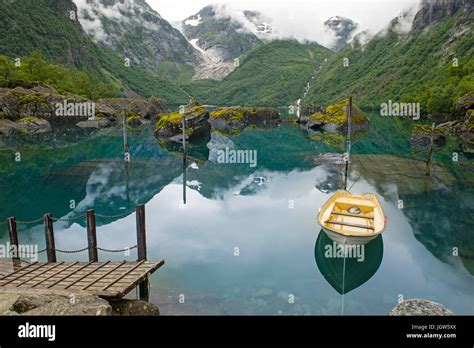 Fishing Boat On Mountain Lake Norway Stock Photo Alamy