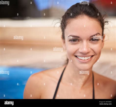 Pretty In The Pool Portrait Of An Attractive Young Woman Smiling In