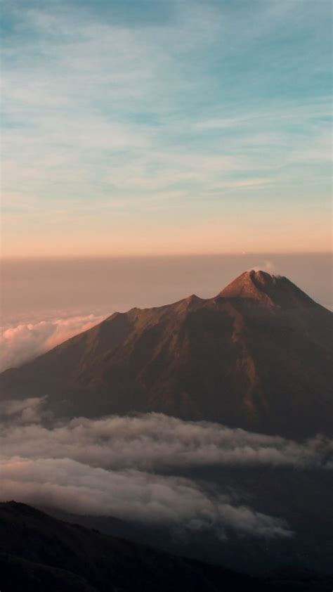 Aerial View Of Majestic Mountains Against Sky During Sunset Jawa