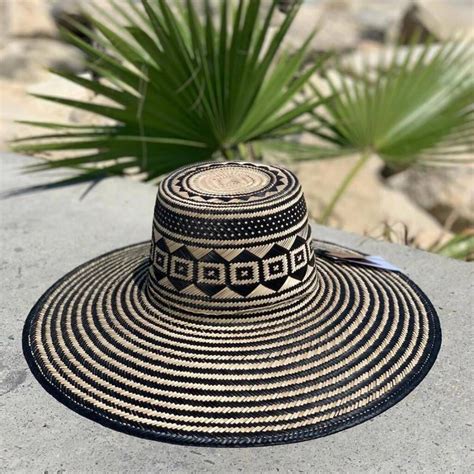 A Stunning Black Natural Straw Hat Turn Heads With This Hats Balance